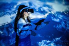 Woman,Using,Virtual,Reality,Headset,,Moving,Hand,At,Interactive,Technology