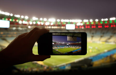 Smartphone,Photographing,Football,Game,On,The,Stadium.