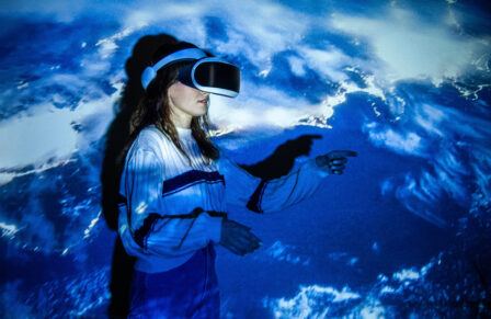 Woman,Using,Virtual,Reality,Headset,,Moving,Hand,At,Interactive,Technology