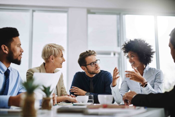 I need everyone to give me their best ideas. Shot of a group of businesspeople sitting together in a meeting.